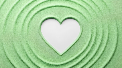 A white heart cutout rests in textured green sand, surrounded by soft concentric ripples, symbolizing love, calm, balance, mindfulness, and minimalistic natural design harmony serenity.
