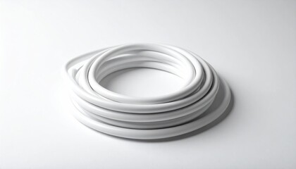 Fototapeta premium Coiled White Cable - A Minimalist Still Life.