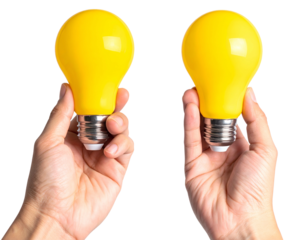 Two hands hold bright yellow light bulbs against black
