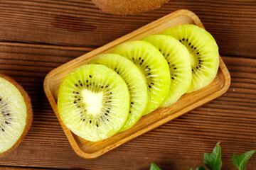 Fresh Green Kiwifruit Slices on Wooden Board - Healthy Tropical Fruit