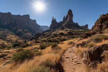 Desert Landscape with Towering Rock Formations in Gran Canaria Under Bright Sun with Blue Sky