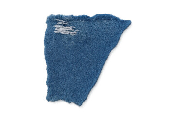 Ripped blue denim fabric patch with frayed edges