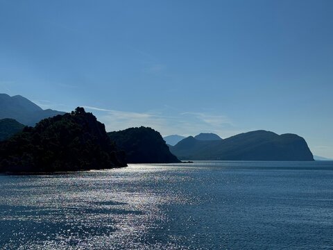 Glittering calm sea and sunny blue sky.