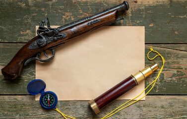A pirate pistol with a spyglass on the table.A quest for children with adventures.Pirate background for the game.