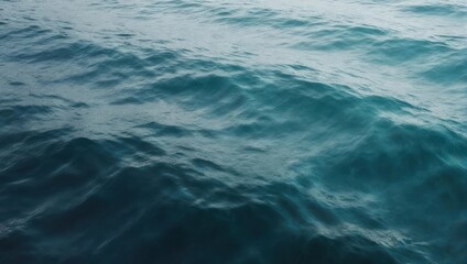 Obraz premium Close up of deep blue ocean waves with sunlight reflecting on the surface.