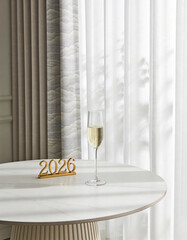 Minimalist luxury interior with a white marble table featuring an elegant champagne glass and a small 2026 gold sculpture, soft morning sunlight, Cloud Dancer palette, quiet luxury style