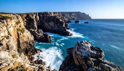 Stunning Coastal Cliffs and Azure Ocean Waves Under a Clear Sky.