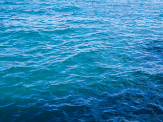 Obraz premium Sea ocean texture blue water nature background, abstract shore clean calm natural summer for tourism travel in holidays, island deep surface.