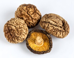 Dried mushrooms with textured caps and one showing the underside