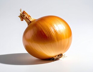 Golden bulb onion with dried top, casting a shadow on white surface