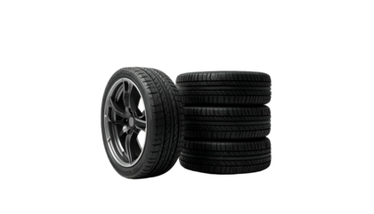 Four car tires, one mounted on a shiny rim, stacked against a black background
