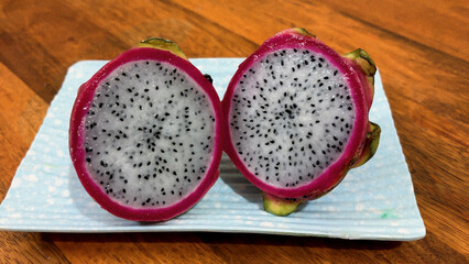 close up of dragon fruit interior with vibrant pink skin
