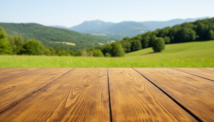 Empty wooden table on a blurred mountain landscape background. Green hills and meadow under a clear blue sky. Natural mockup for travel, food display, and product advertisement.