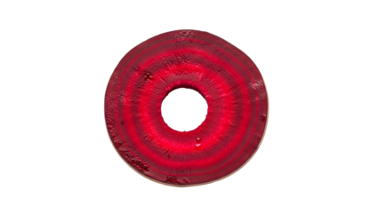 Close up of a sliced beetroot showing concentric rings of vibrant red and pink