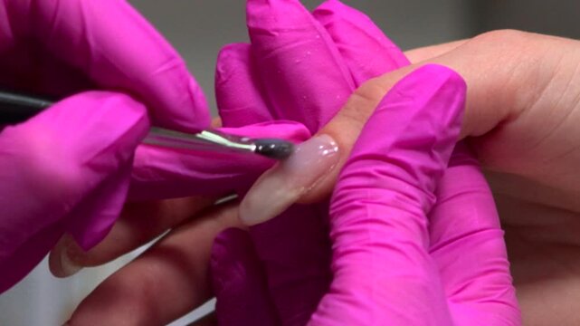 Precise Technician Designs Flawless Nails, Skilled Specialist Carefully Creates Immaculate Acrylic Nails. Media