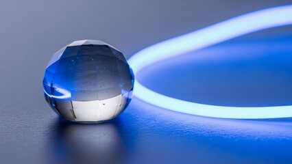 Abstract crystal sphere with glowing blue light in futuristic design