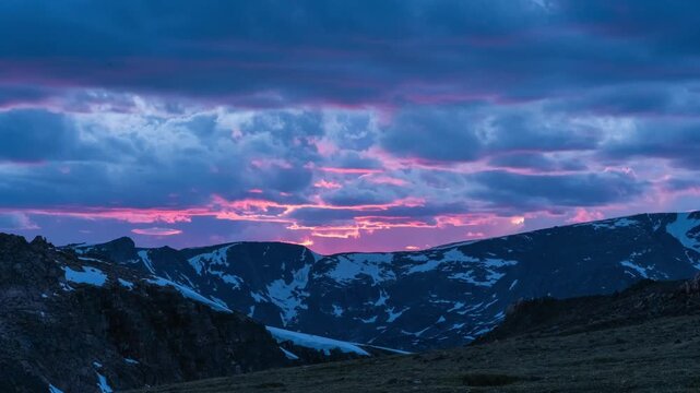 Brilliant sunset clouds timelapse over mountains 