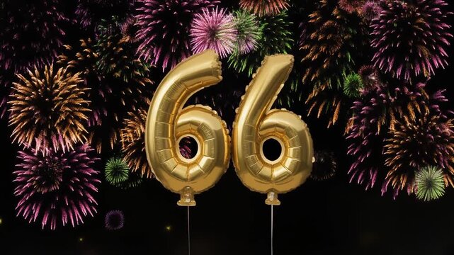 Gold balloon number 66 with fireworks in the background. Festive scene for birthday or anniversary party