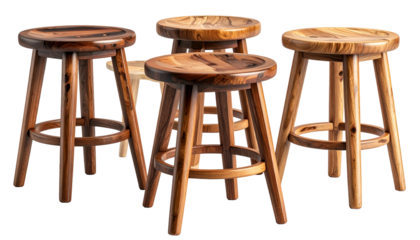 Four wooden stools, various wood grains and tones, arranged in front of a dark backdrop