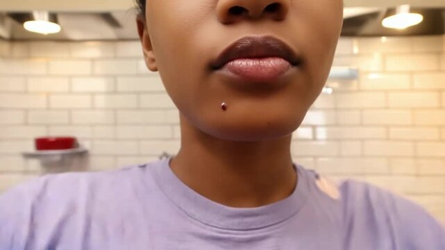 Person popping a pimple.