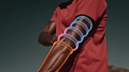 A person demonstrates how to wear a fitness tracker on their arm while preparing for outdoor activities. The tracker shows performance data as they move - Powered by Adobe