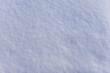 Fresh snow surface close up showing soft fluffy white texture details