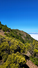 Fototapeta premium Pico Malpaso with communication tower overlooking a sea of clouds, Island El Hierro, Canary Islands, Spain, Europe.