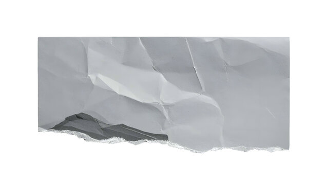 A ripped and crumpled rectangle of off-white paper isolated against a stark black background