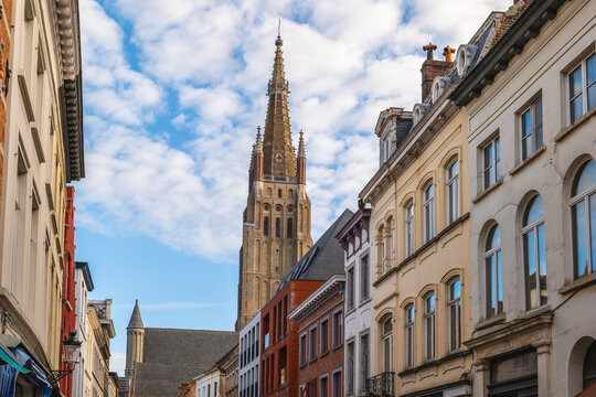 Street view of Bruges and Church of Our Lady bell tower, Belgium