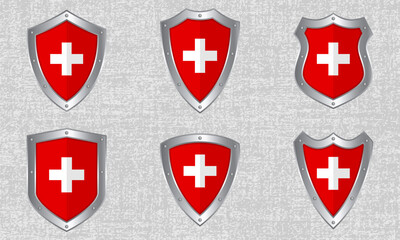 Set of metal shields with the Swiss flag