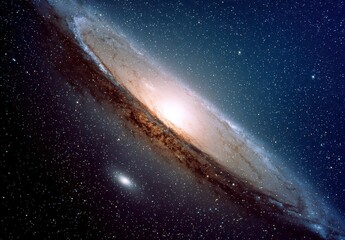 Andromeda Galaxy Displaying Swirling Bands of Stars and Dust Against a Deep Blue Space Background Filled with Tiny Pinpoints of Light