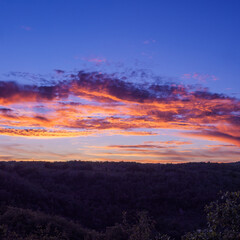 Fototapeta premium Dramatic Fiery Orange And Purple Sunset Sky Background