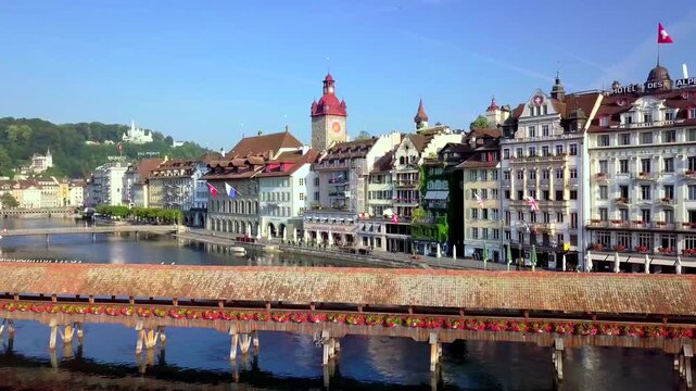 Aerial summer view of Lucerne with Chapel Bridge old town and birds in flight