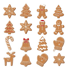 Fototapeta premium Traditional festive christmas gingerbread cookies shaped like stars trees bells gingerbread men candy canes and mittens with white icing.