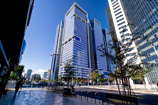 Life in modern Middle Eastern city. Financial districts with skyscrapers, people, and traffic, Tel Aviv, Israel.