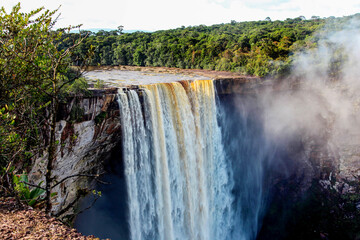 Kaichur waterfall with a beautiful stream of water on a clear sunny day in the middle of the jungle, Guyana. Subtropics, world tourism.
