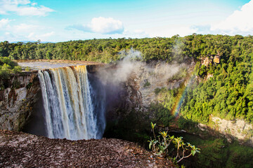 Kaichur waterfall with a beautiful stream of water on a clear sunny day in the middle of the jungle, Guyana. Subtropics, world tourism.