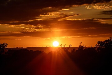 Golden Sunrise Through Dramatic Clouds. Golden hour