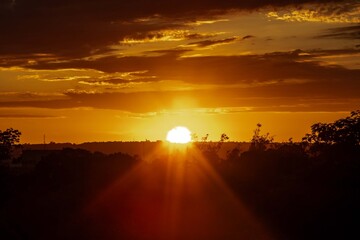 Golden Sunrise Through Dramatic Clouds. Golden hour