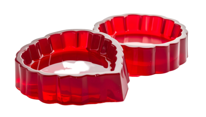 Two translucent red heart-shaped molds, one overlapping the other, isolated
