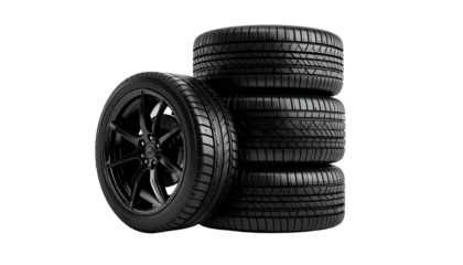 Stack of black car tires with a focus on tread pattern and rim details on a dark background
