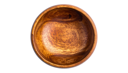 Overhead view of a circular wooden bowl against a black background