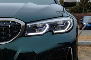 January 3, 2021, Seoul, South Korea - A close-up view of the LED headlight and kidney grille of a BMW M340i sedan. © heerim studio