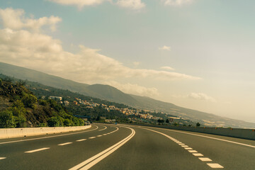 Fototapeta premium marking different lanes, on the dark asphalt floor of a highway. Tenerife, Canary Islands, Spain.