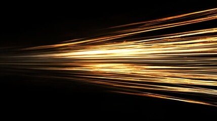 Motion blur of golden light trails on dark backdrop, suitable for music visuals, nightlife themes, or futuristic compositions.