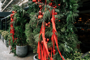 Festive Christmas Tree Decorated with Red Baubles and Ribbons