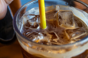 iced coffee with a yellow straw