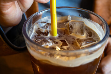 iced coffee with a yellow straw