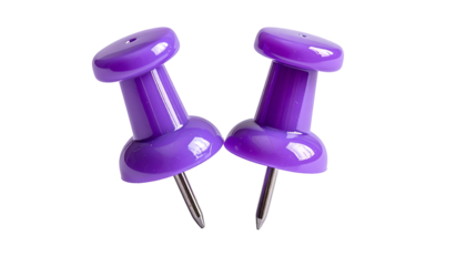 Two close-up purple pushpins, slightly angled, against a stark black background