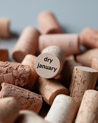 Cork stoppers display dry january message promoting alcohol-free healthy lifestyle choices.